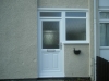 Door With Raised Decorative Lower Panel & Adjacent Window