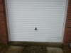 white-steel-manual-up-and-over-garage-door